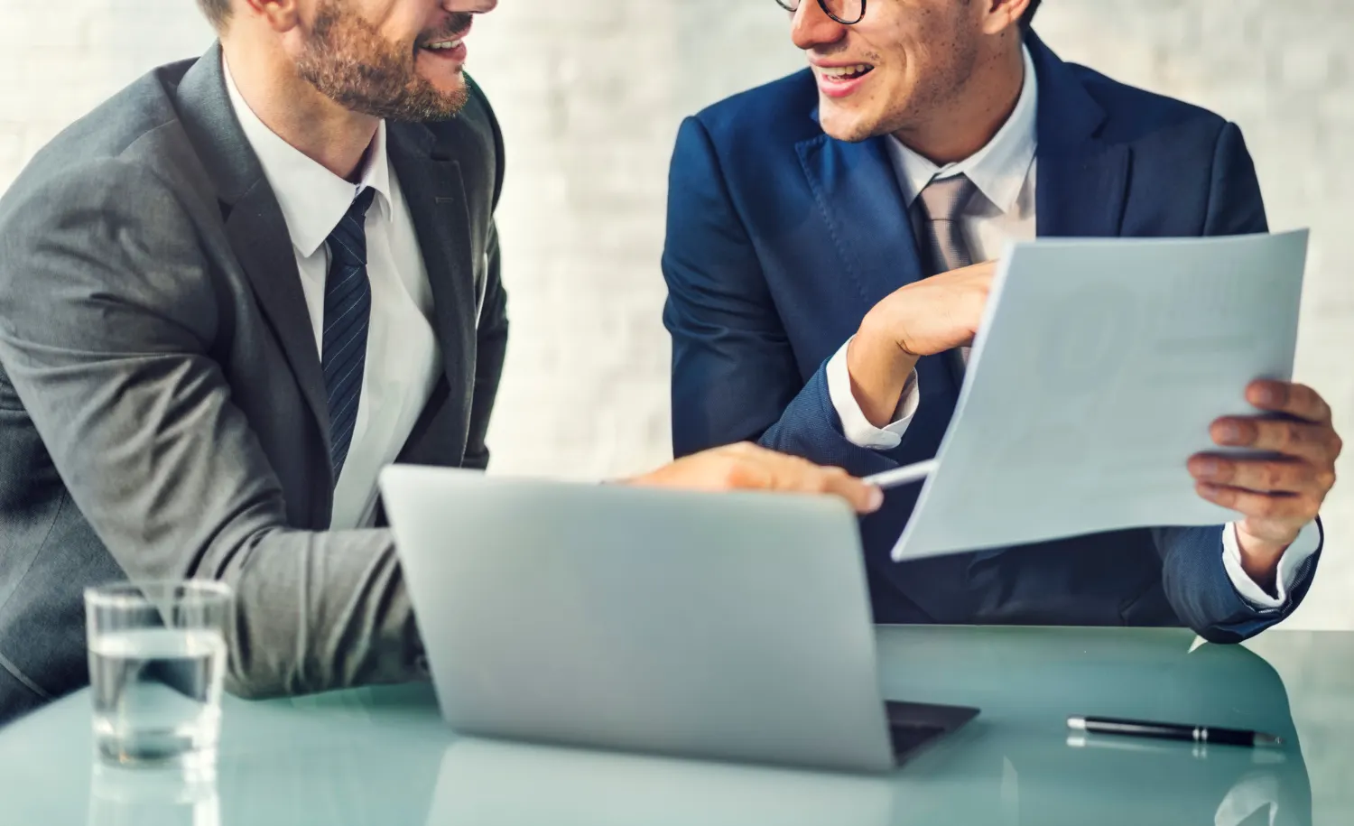 Consultants working together at a desk